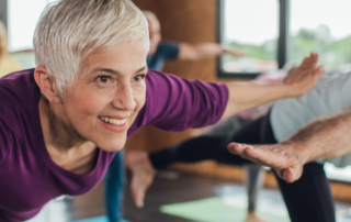 Healthy older woman practicing yoga